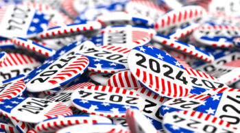 Pile of 2024 election buttons campaign buttons featuring the american flag