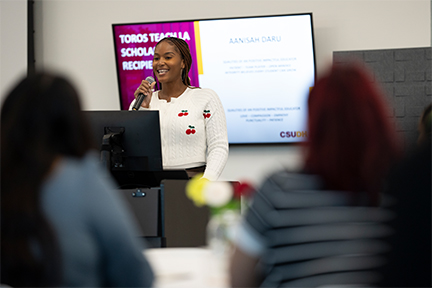 Aanisah Daru speaks at the TTLA scholarship event.