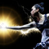 Female dancer with light emanating from her outstretched hand