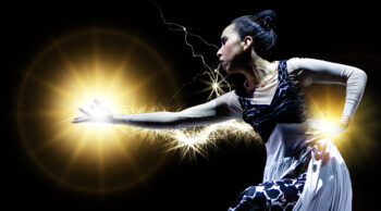 Female dancer with light emanating from her outstretched hand