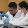 Clinical science students working in a lab on campus.