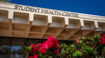 CSUDH Student Health Center with flowers in the foreground