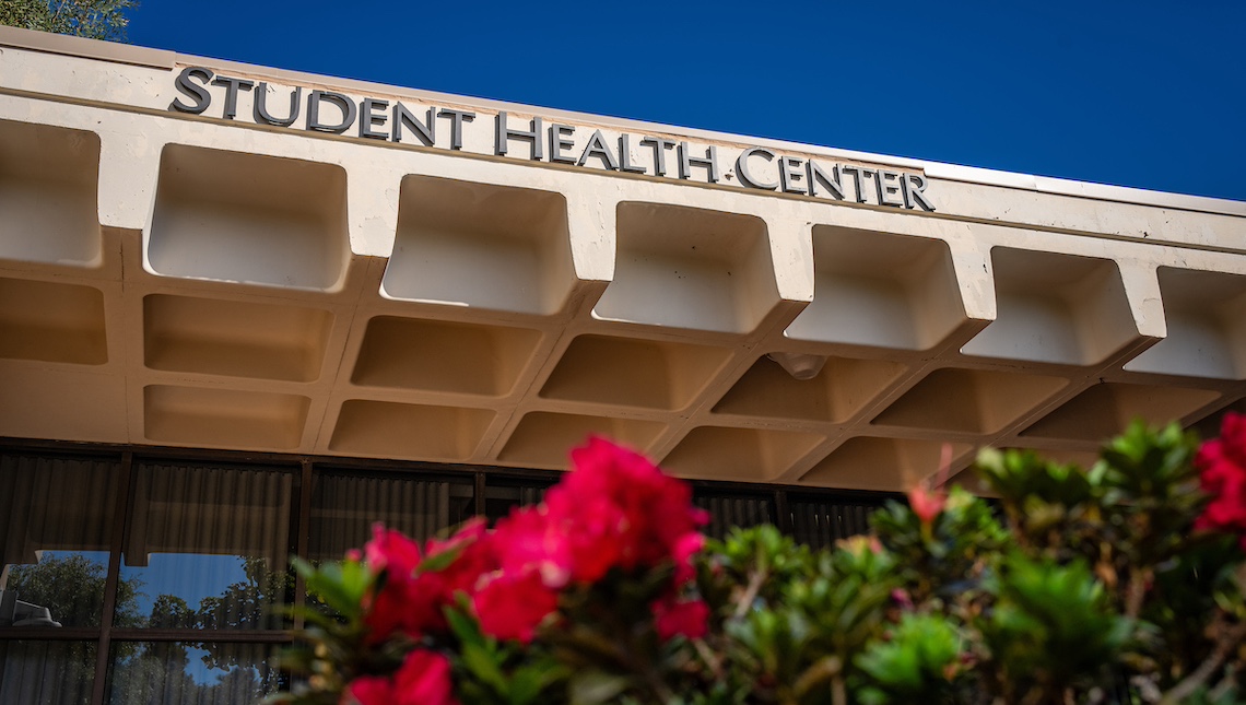 CSUDH Student Health Center with flowers in the foreground