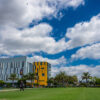 Campus shot of I&I building with blue sky and clouds