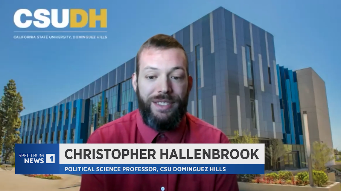 Chyron: Christopher Hallenbrook, Political Science Professor, CSU Dominugez Hills