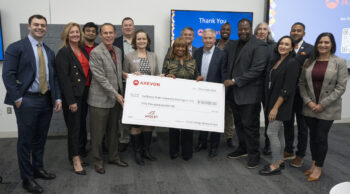 Group of people holding an oversize check for $50,000