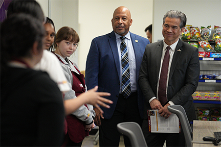 CA AG Rob Bonta, right, greets College Corps fellows at Teddy's Pantry.