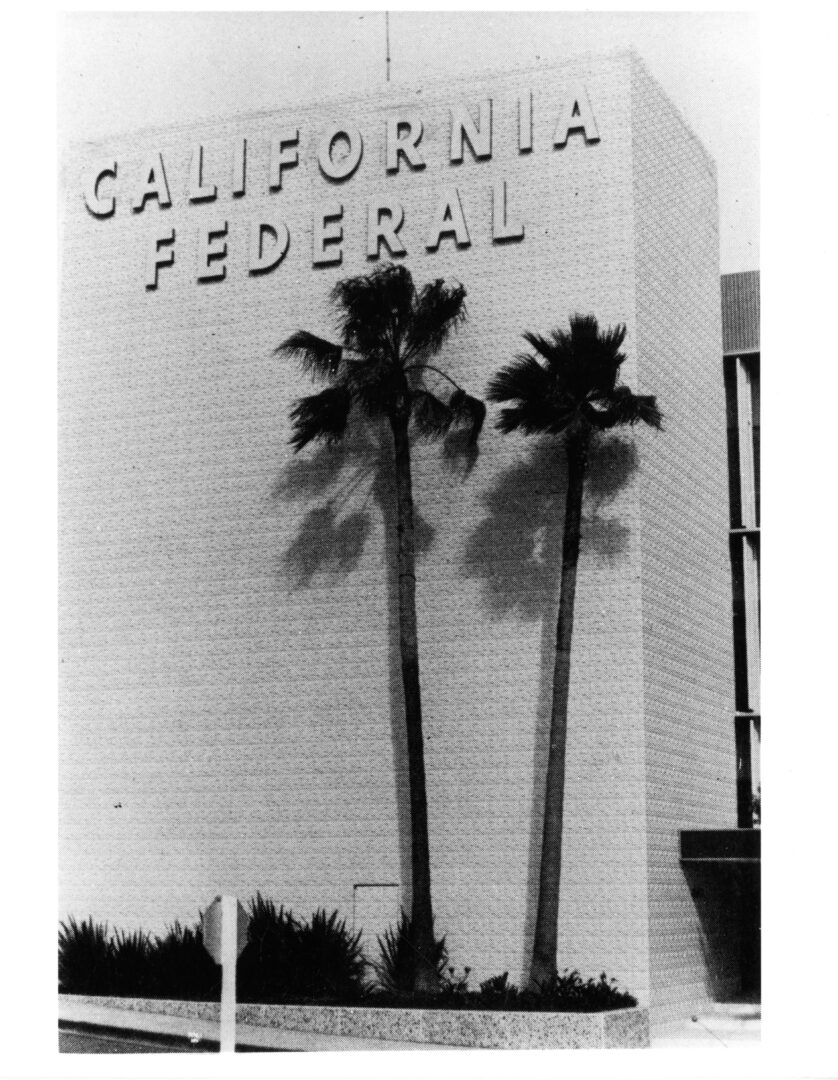 Black and white photo of tall building with "California Federal" in text at top