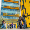 Students walking in front of the Innovation & Instruction building on campus