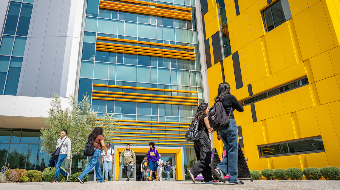 Students walking in front of the Innovation & Instruction building on campus