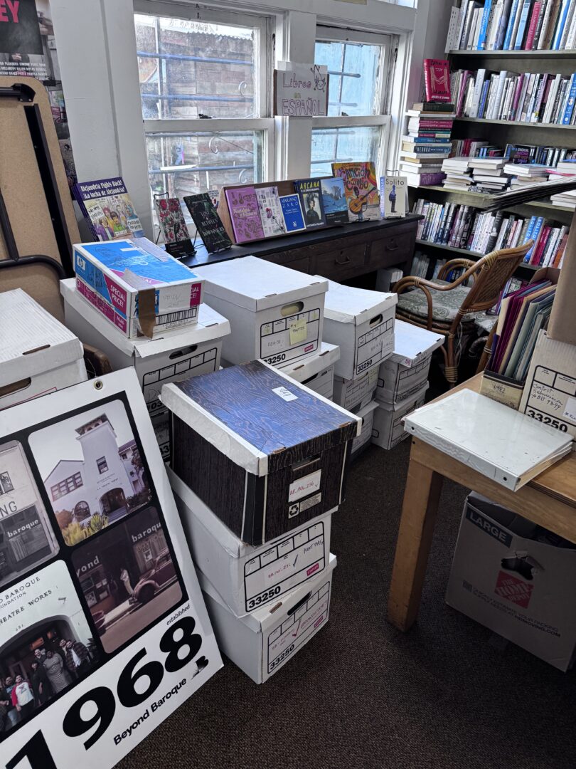 Boxes and books in an office space.