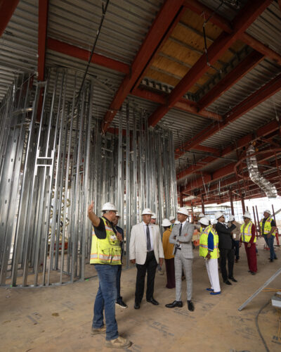 Construction workers and CSUDH leadership at building site