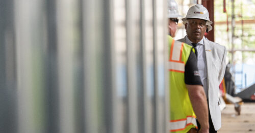 President Parham and a construction worker on site.