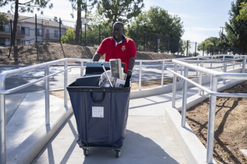 Gentleman pushing a move-in cart