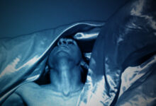 Person moving under cloth