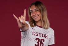 CSUDH soccer player doing Toro hand signal