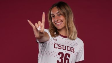CSUDH soccer player doing Toro hand signal