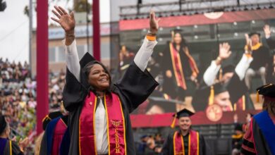Graduate onstage at Commencement