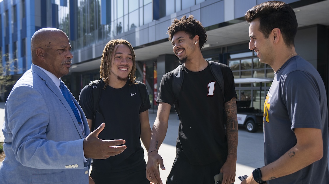 President Parham speaking on campus to students