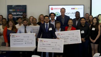 Smiling winners and participants with checks