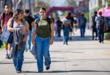 Smiling students walking on campus