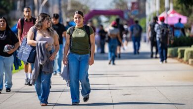 Smiling students walking on campus
