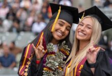 Smiling grads at Commencement