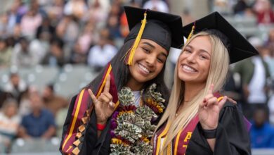 Smiling grads at Commencement