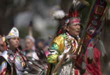 Eagle Staff Bearer, tribal Elder and veteran Richard Parker at the Powwow Grand Entry.