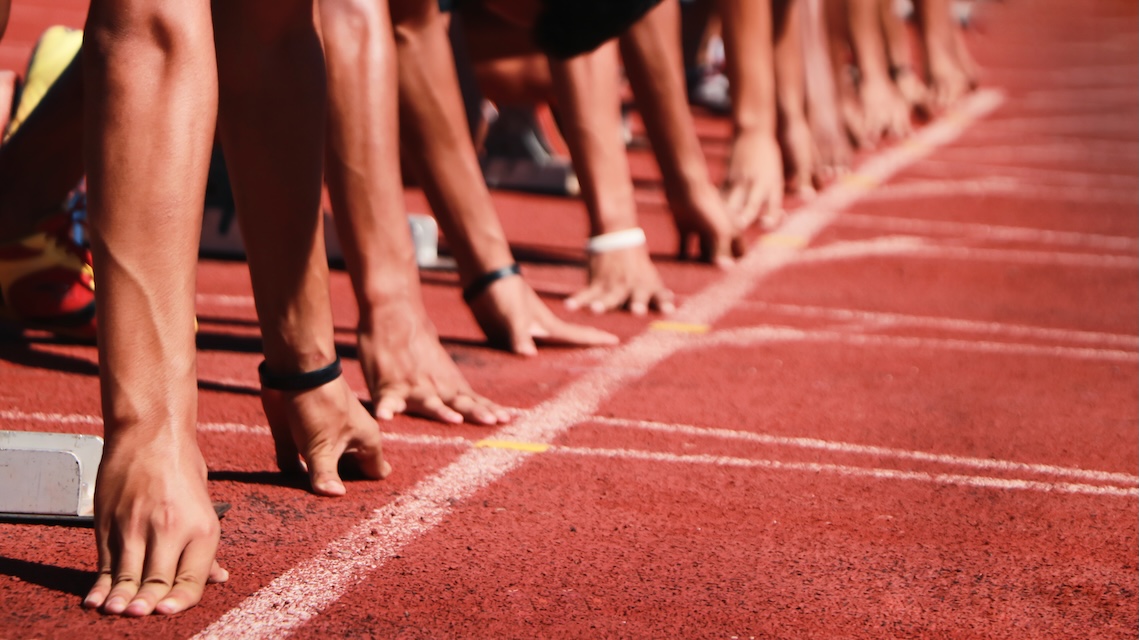 Runners in starting position on a track
