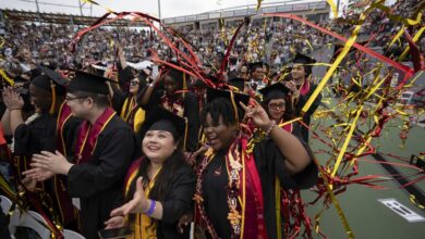 Graduates celebrating at Commencement