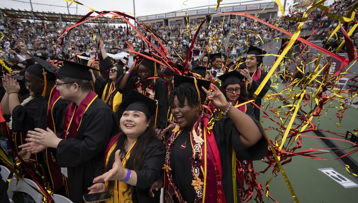 Graduates celebrating at Commencement