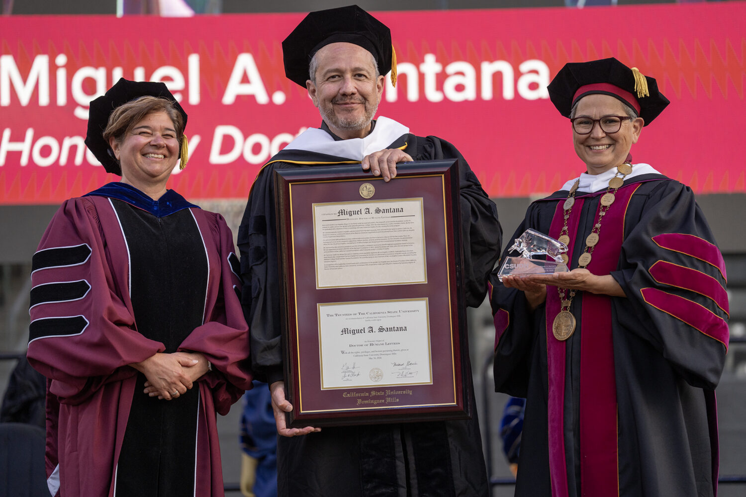 Miguel Santana (center), with CSUDH Interim Provost Kim Costino and Interim President Mary Ann Villarreal