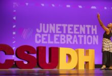Dancer with CSUDH letters and Juneteenth Celebration sign
