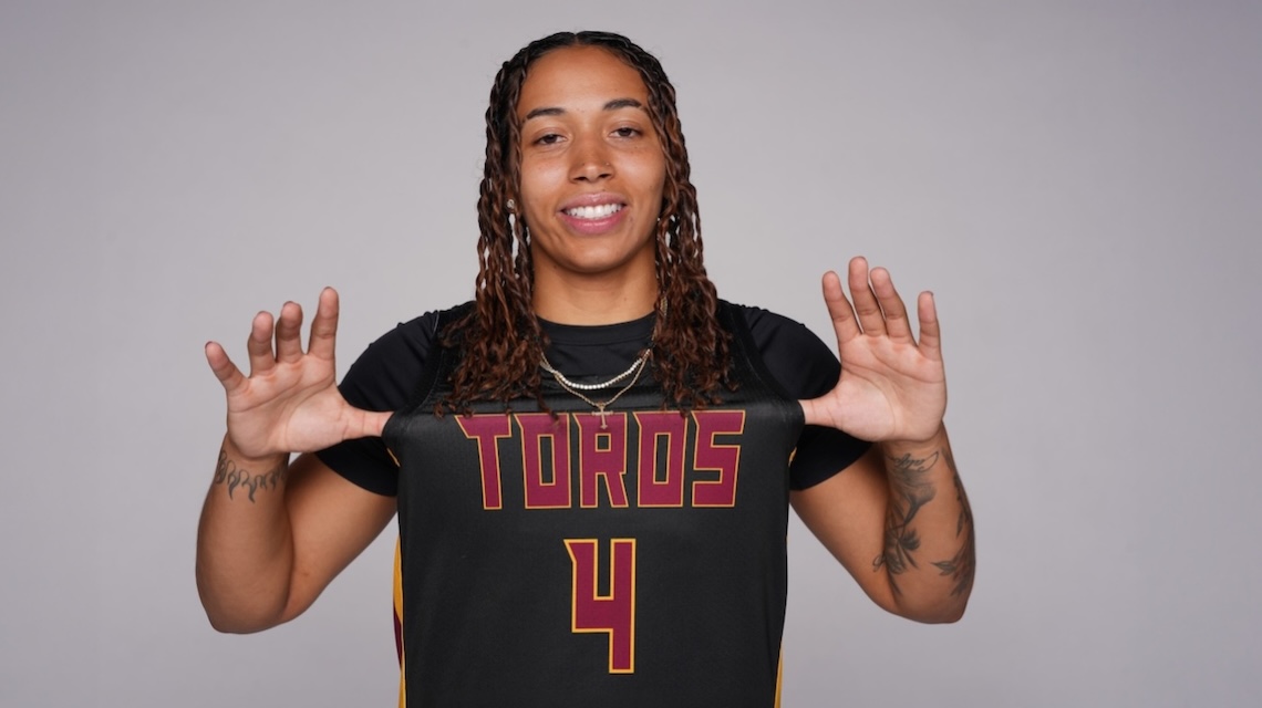 Kylee Egar wearing her #4 basketball jersey