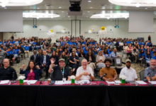 Photo of LSU ballroom showing showcase judging panel and attendees