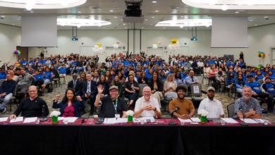 Photo of LSU ballroom showing showcase judging panel and attendees