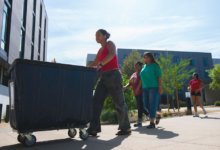 A new student pushing a moving cart