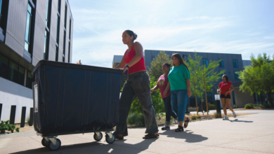 A new student pushing a moving cart