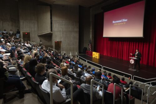 President of CSUDH Alumni Advisory Council Raymund Diaz onstage
