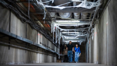 Visitors in the cobweb-decorated underground tunnels